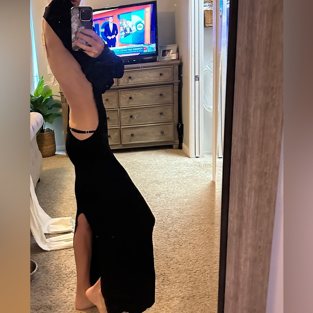 Sexy, long black dress with open back.